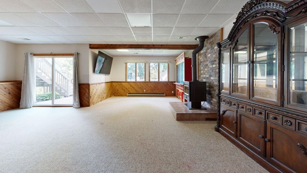 A panelled lower level with a fireplace