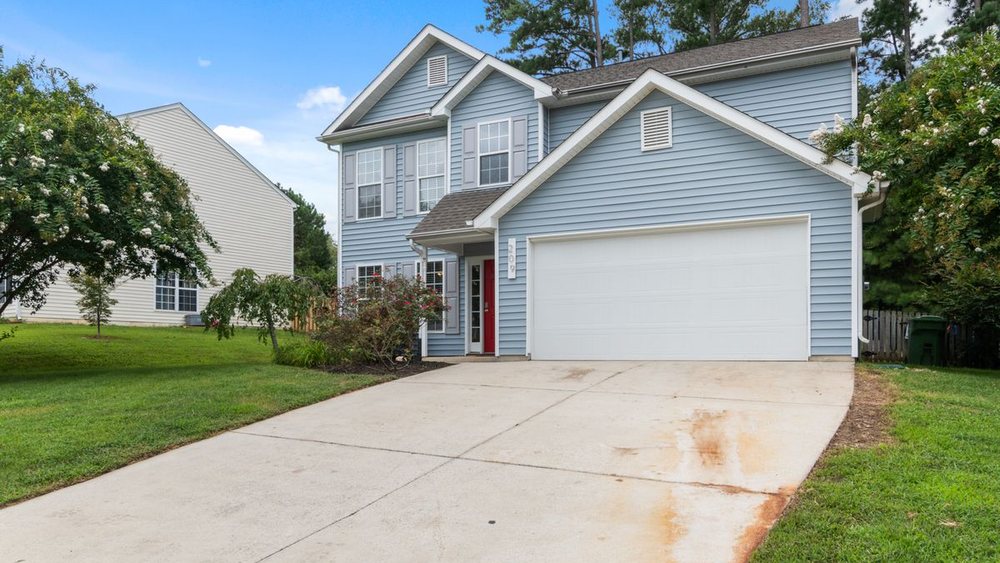 A suburban house front with the addition to the side