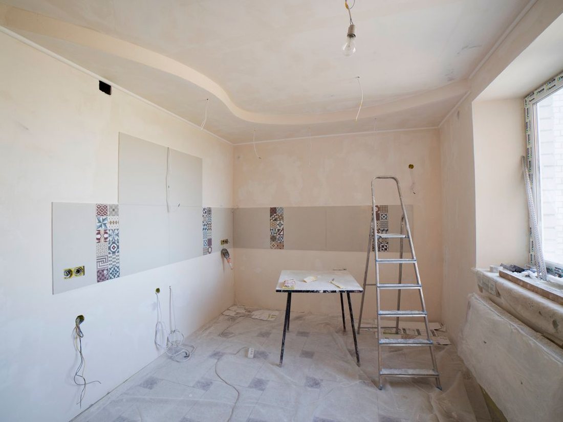 Drywall up and cabinetry going in, mid-build