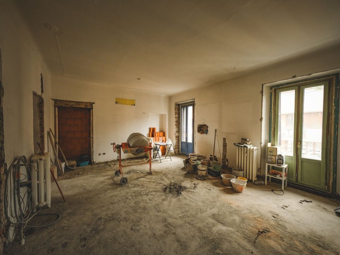 A room stripped back with the trades’ tools still on the floor