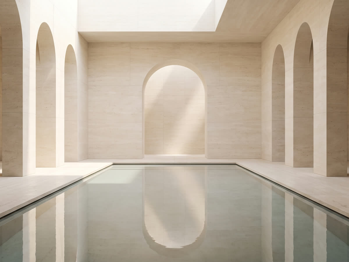 A minimal architectural interior with soft light and water